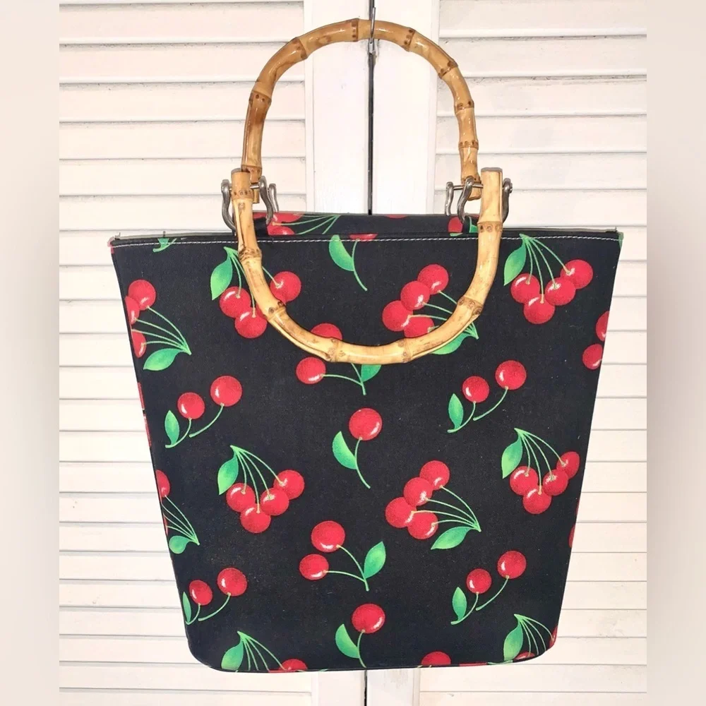Black purse with red cherries and bamboo handles large